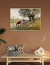 Framed painting of a pastoral scene with a cow and child on a brown wall above a wooden bench with decorative pillows and vases.