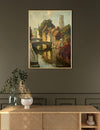 Framed painting of a canal scene above a wooden console table with decorative items.