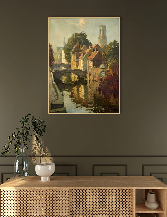 Framed painting of a canal scene above a wooden console table with decorative items.