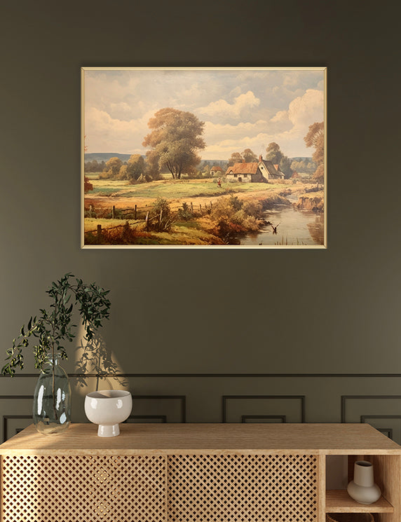 Framed landscape painting on a wall above a wooden console table.
