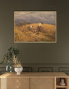 Framed painting of a harvest scene above a wooden console table with decorative items.