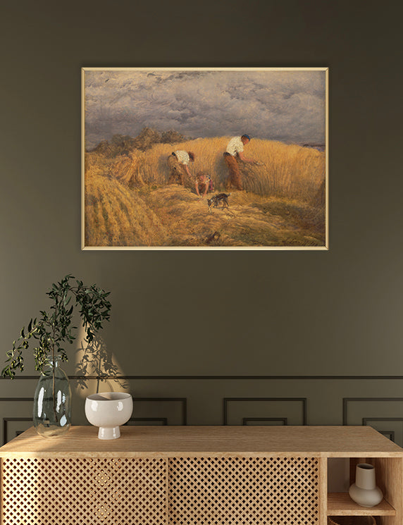 Framed painting of a harvest scene above a wooden console table with decorative items.