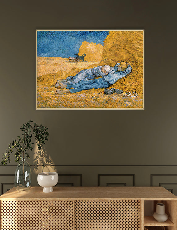 Two laborers lie atop a golden mound of straw, their bodies relaxed in the midday sun. Dressed in pale blue work clothes