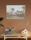 Framed landscape painting on a wall above a wooden bench with decorative pillows and vases.
