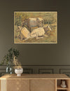 Framed artwork of cows on a wall above a wooden console table.