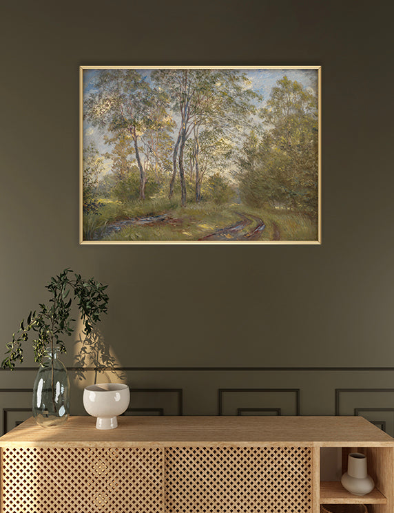 Framed landscape painting on a wall above a wooden console table.
