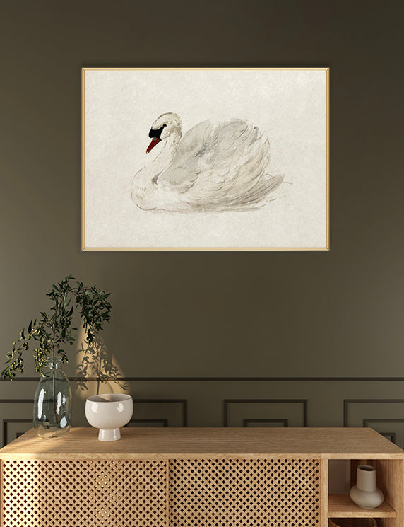 Framed artwork of a swan on a wall above a wooden console table.