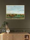 Framed painting of a horse race on a wall above a wooden console table.