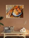 Framed still life painting of peaches on a plate above a wooden bench with decorative pillows and vases.