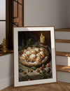 Framed artwork of a still life with pastries and candles on a wooden floor.