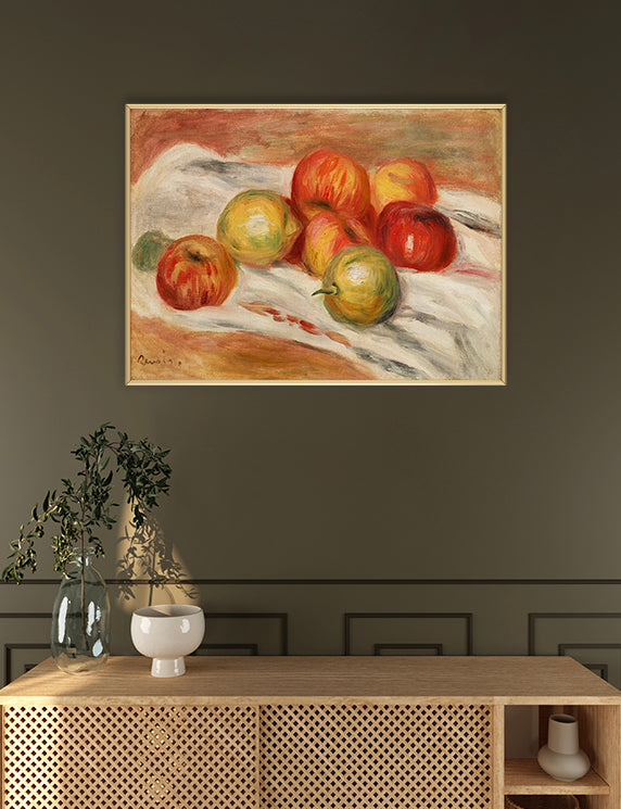 Framed painting of apples on a dark wall above a wooden console table.