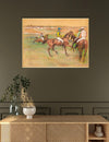 Artistic depiction of horse racing on a wall above a wooden cabinet.