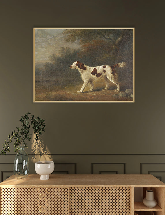 Spaniel in the Woods is a quiet portrait of attentiveness and grace. A white and brown spaniel stands alert in profile, its gaze fixed on something just beyond the frame.