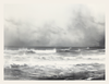 Tempest Veil captures the moody majesty of the open sea beneath a heavy sky. Waves rise and collapse in chaotic harmony, obscured slightly by a mist that blurs the divide between ocean and atmosphere. The monochrome palette sharpens the drama, evoking the timeless might of nature and the isolation it can stir in us.