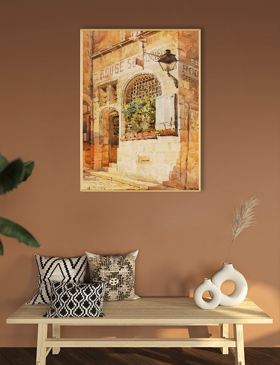 Decorative scene with a painting of a street scene, pillows, and vases on a bench against a brown wall.